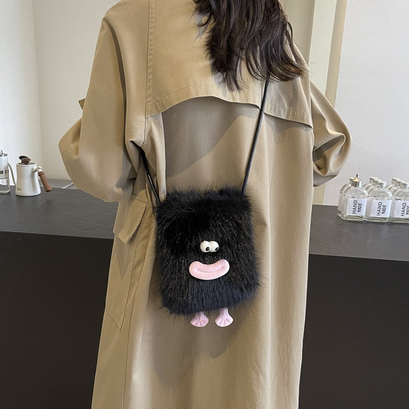 Kawaii cartoon phone bag with cute character design  Cartoon-inspired phone bag for fashion-forward individuals