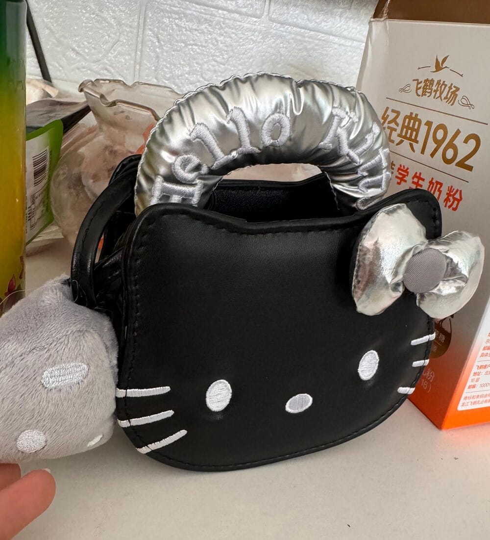 KT cat Kelly mini handbag perfect for gifts  Cartoon animal handbag Kelly mini with KT cat  Stylish KT cat mini handbag with gold buckle  Cute and trendy Kelly mini handbag featuring KT cat