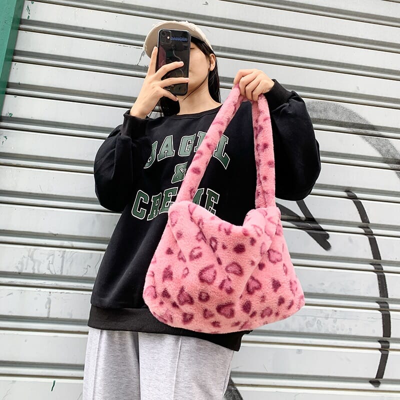 Cute black and white floral plush bag, stylish and cozy fashion accessory with a floral print